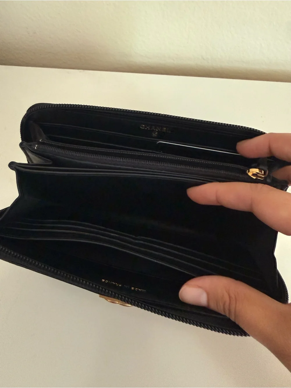 CHANEL Black Quilted Zip-Around Wallet with Gold CC Lock